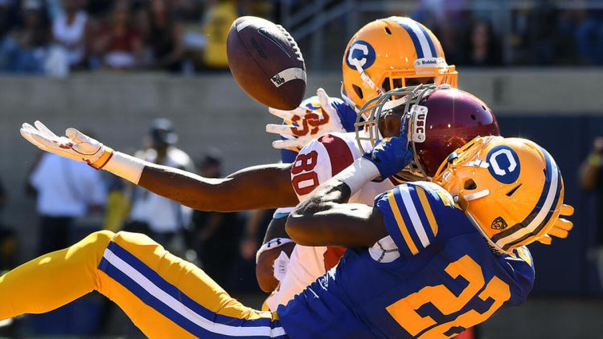 USC receiver Deontay Burnett can't make the catch in the end zone against the defense of Cal cornerback Derrick Clark. To see more images from the game, click on the photo above.