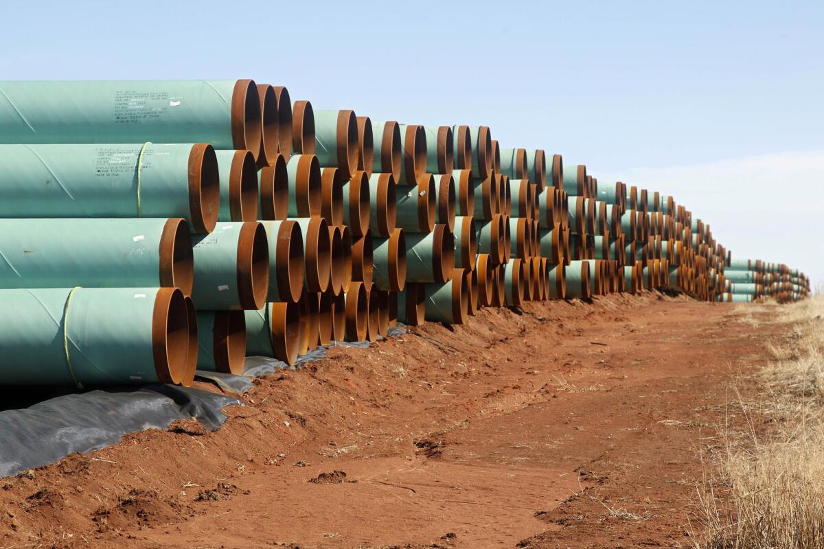 Miles of pipe ready to become part of the Keystone Pipeline are stacked in a field near Cushing, Okla. on Feb. 1, 2012.