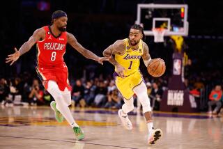 LOS ANGELES, CA - FEBRUARY 15: D'Angelp Russel (1) drives the ball as the Lakers play the Pelicans at Crypto.com arena on Wednesday, Feb. 15, 2023 in Los Angeles, CA. (Jason Armond / Los Angeles Times)