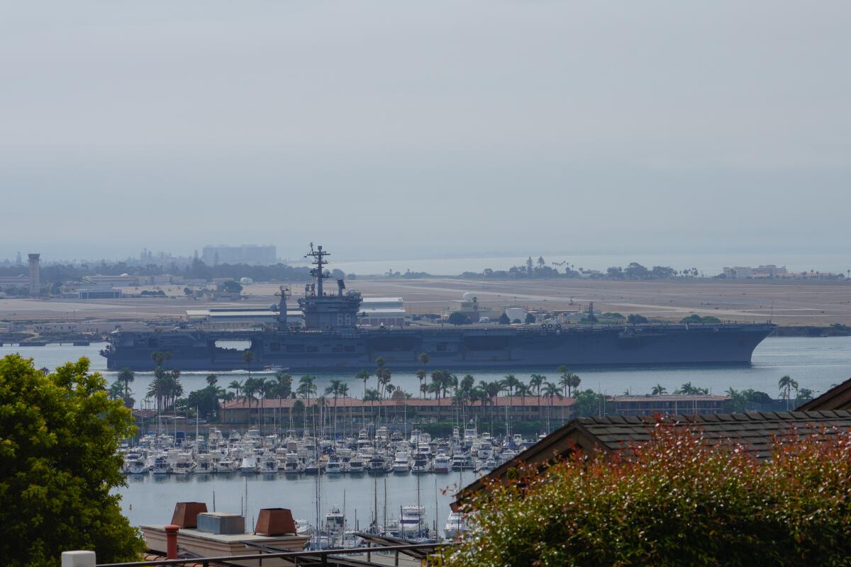 The carrier USS Nimitz was among the warships that left San Diego Bay Saturday to ride the storm at sea.