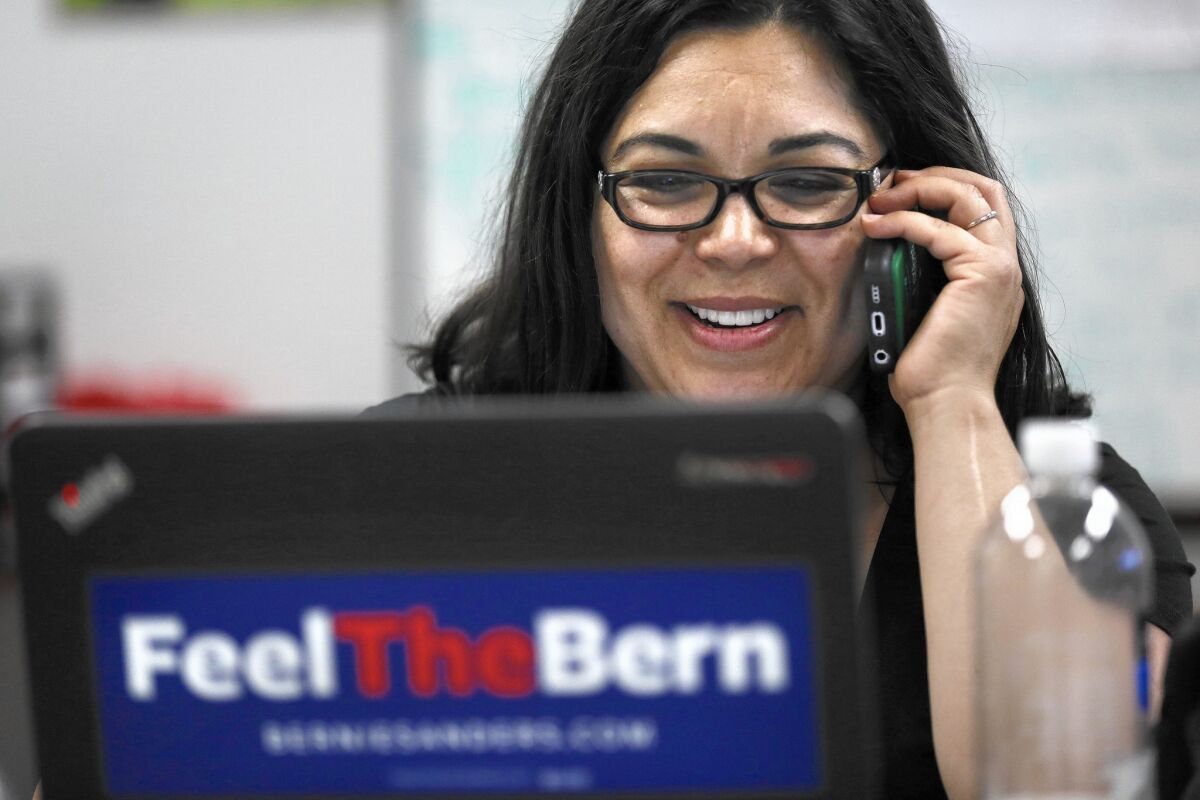 Sara Gurling is among volunteers making calls in support of Bernie Sanders' presidential campaign at a call center in Orange. Many of the volunteers are from the California Nurses Assn.