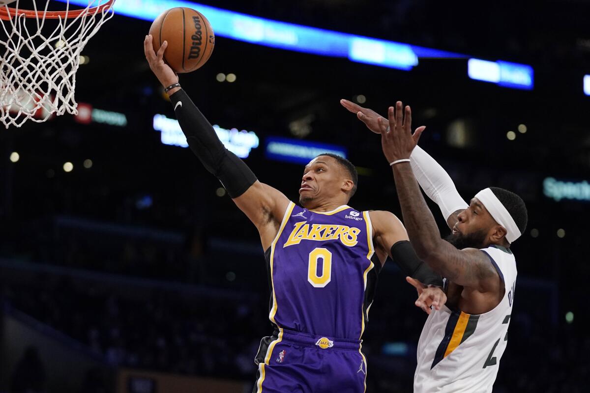 Lakers guard Russell Westbrook shoots as Utah Jazz forward Royce O'Neale defends.