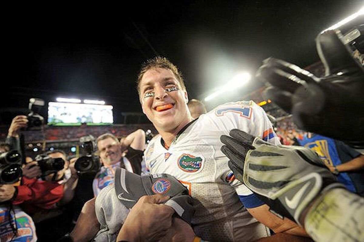 Tim Tebow celebrates after leading Florida to a 24-14 win over Oklahoma for the BCS national championship on Jan. 8, 2009.