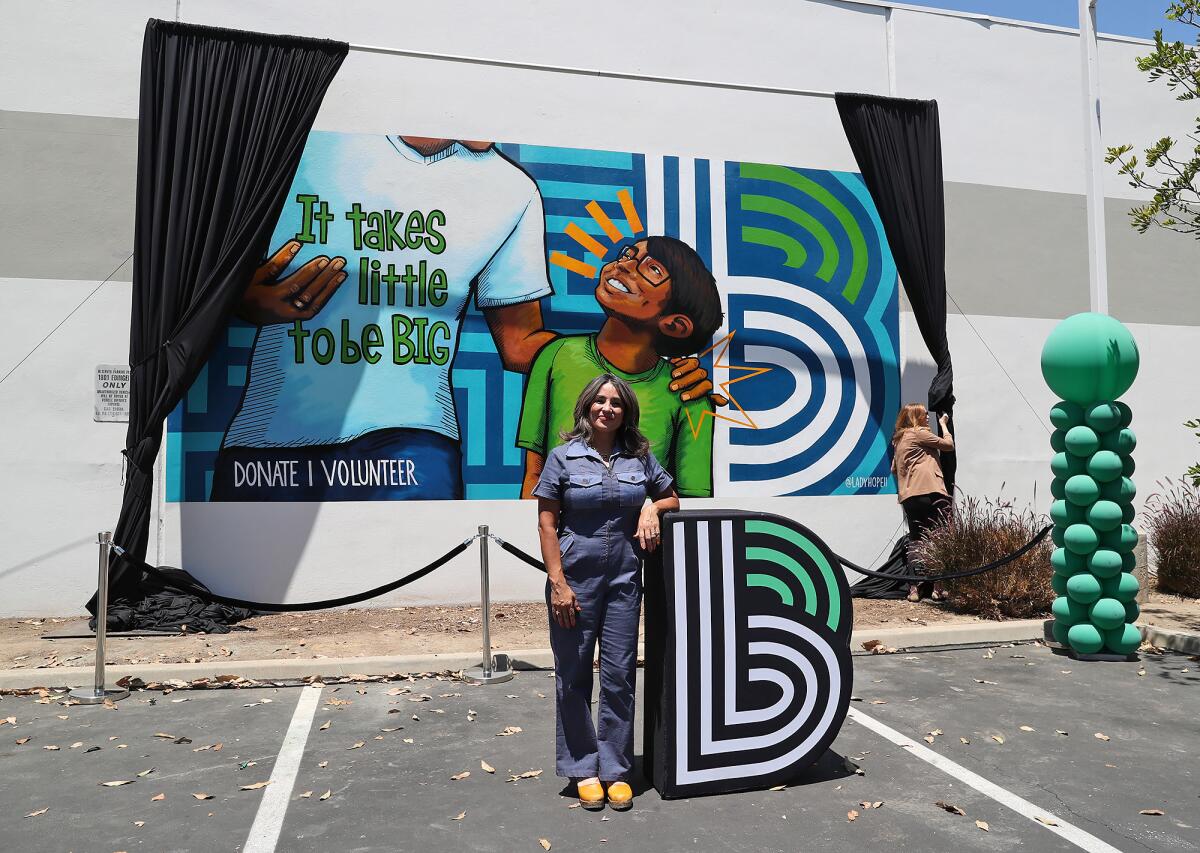 Artist Carla Roque created the new mural at the Big Brothers Big Sisters of Orange County headquarters.