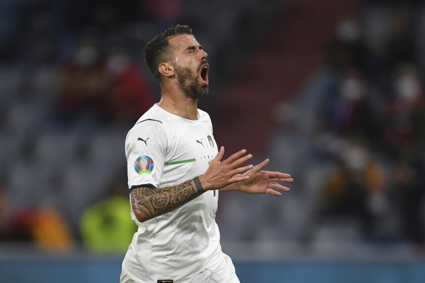 Italy's Leonardo Spinazzola reacts after missing an opportunity to score during a Euro 2020 soccer championship quarterfinal match between Belgium and Italy at the Allianz Arena in Munich, Germany, Friday, July 2, 2021. (Andreas Gebert/Pool Photo via AP)