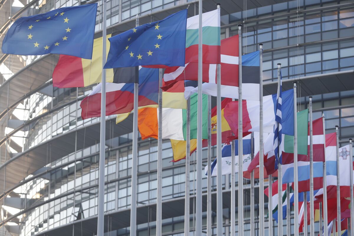 European flags are pictured outside the European Parliament Wednesday, Jan. 19, 2022 in Strasbourg, eastern France. (AP Photo/Jean-Francois Badias)