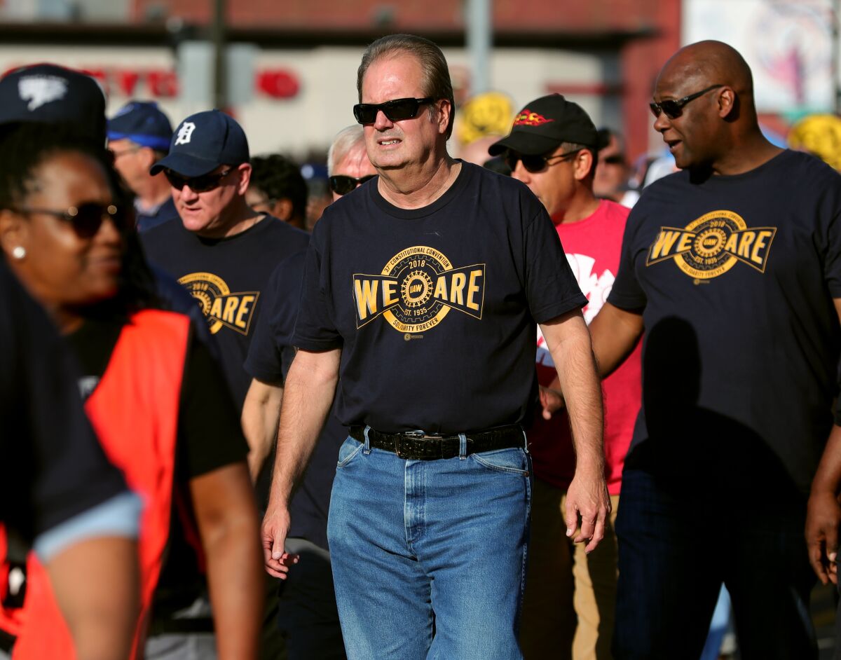 UAW President Gary Jones marches with union workers in the Labor Day parade down Michigan Avenue in Detroit.