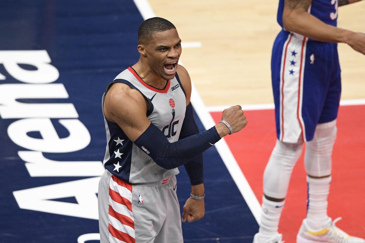 Washington Wizards guard Russell Westbrook reacts after he scored and was fouled.