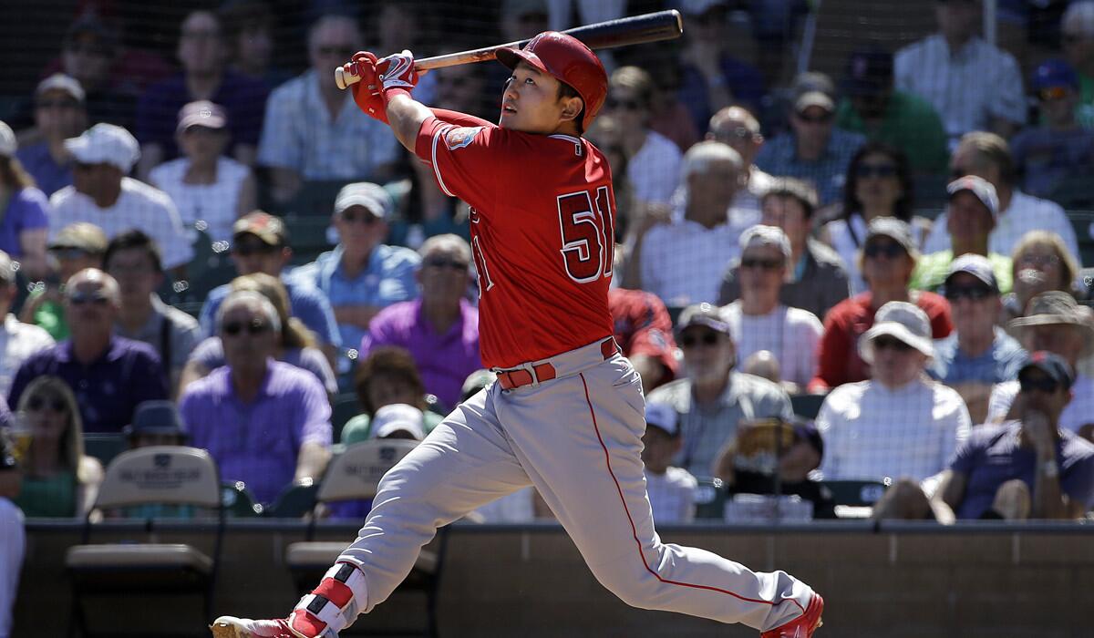 Angels' Ji-Man Choi bats against the Colorado Rockies during a spring training game in Scottsdale, Ariz. on March 17.