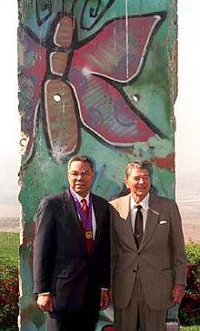 A piece of the Berlin Wall is the backdrop for Reagan and his former national security adviser, Colin Powell, in 1993.