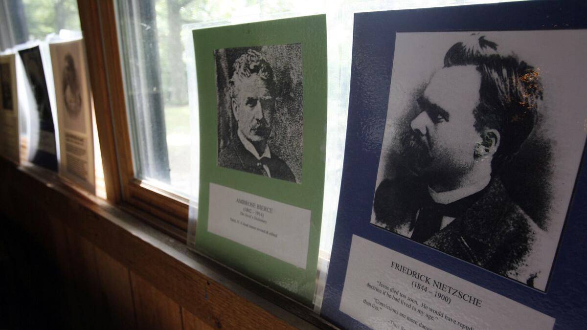 Photos of "free thinkers" including Nietzsche line the walls of the dining hall at a camp in Clarkesville, Ohio on June 22, 2007.