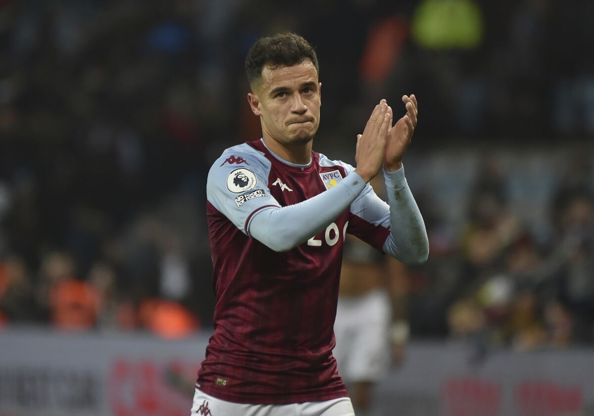 Aston Villa's Philippe Coutinho applauds at the end of the English Premier League soccer match between Aston Villa and Manchester United at Villa Park in Birmingham, England, Saturday, Jan. 15, 2022. (AP Photo/Rui Vieira)