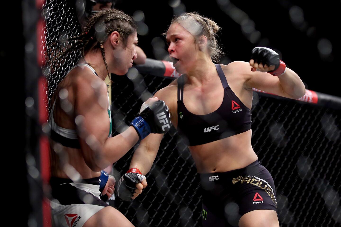 RIO DE JANEIRO, BRAZIL - AUGUST 01: Ronda Rousey of the United States (red) defeats Bethe Correia of Brazi (blue) l in their bantamweight title fight during the UFC 190 Rousey v Correia at HSBC Arena on August 1, 2015 in Rio de Janeiro, Brazil. (Photo by Matthew Stockman/Getty Images) ** OUTS - ELSENT, FPG - OUTS * NM, PH, VA if sourced by CT, LA or MoD **