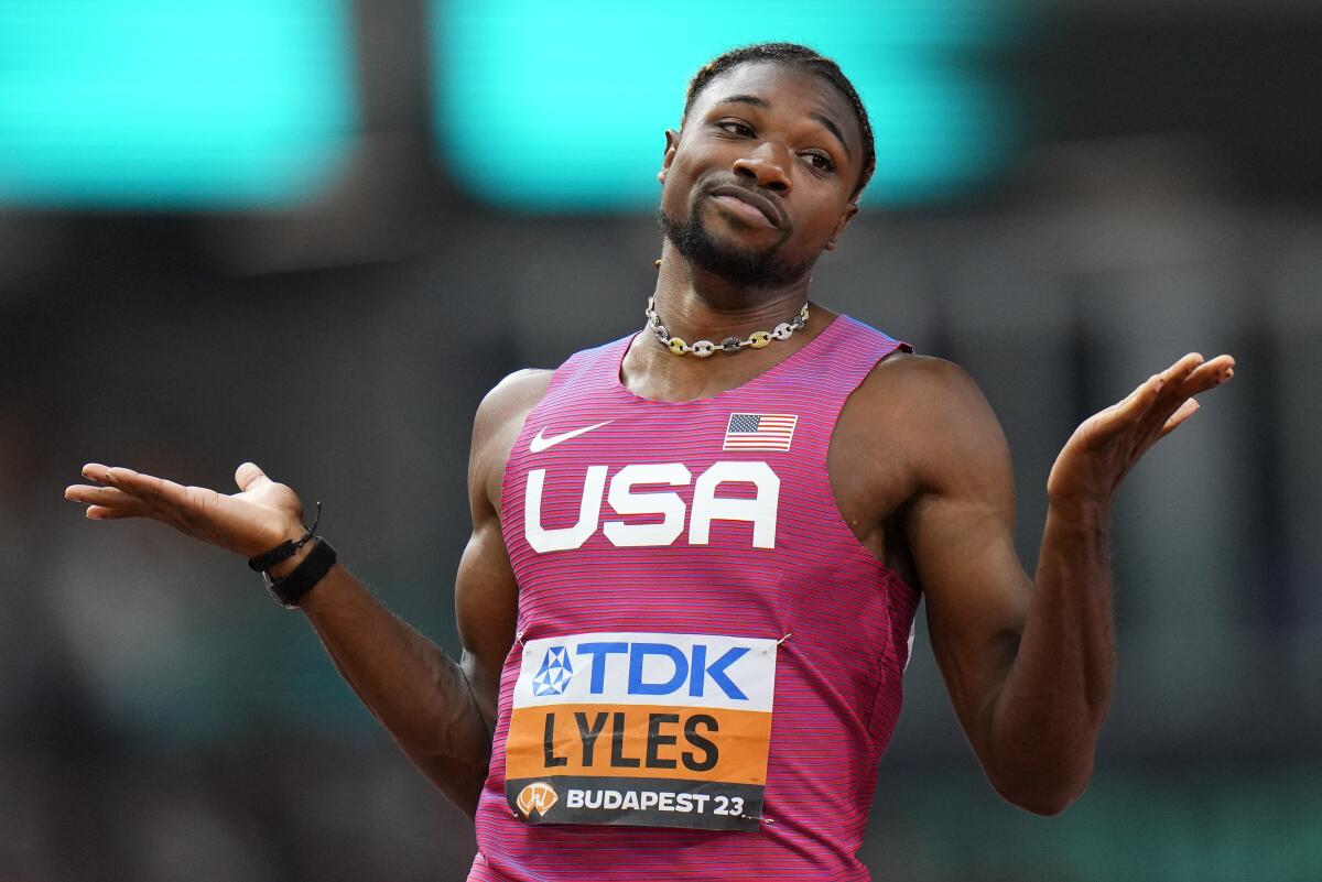 Noah Lyles reacts after crossing the finish line in a men's 200-meter semifinal at the World Athletics Championships.