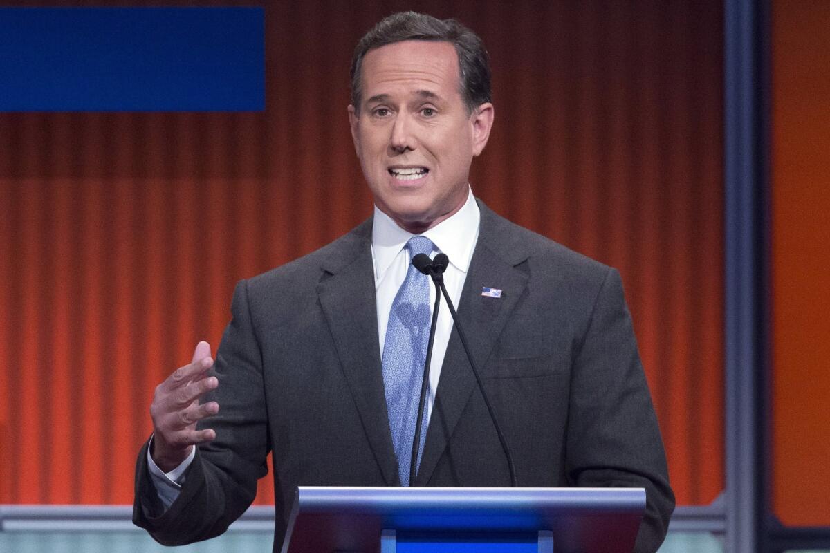 Former Sen. Rick Santorum stands at a lecturn.