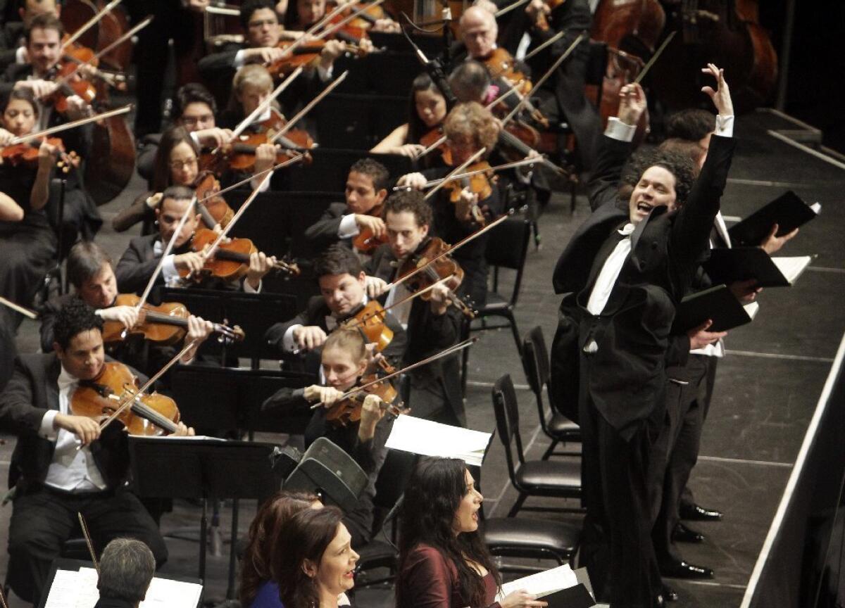 Gustavo Dudamel conducts combined forces of the Los Angeles Philharmonic and Simon Bolivar Symphony Orchestra in 2012 at Disney Hall. Dudamel made his United Arab Emirates debut this week with the Bolivar orchestra.