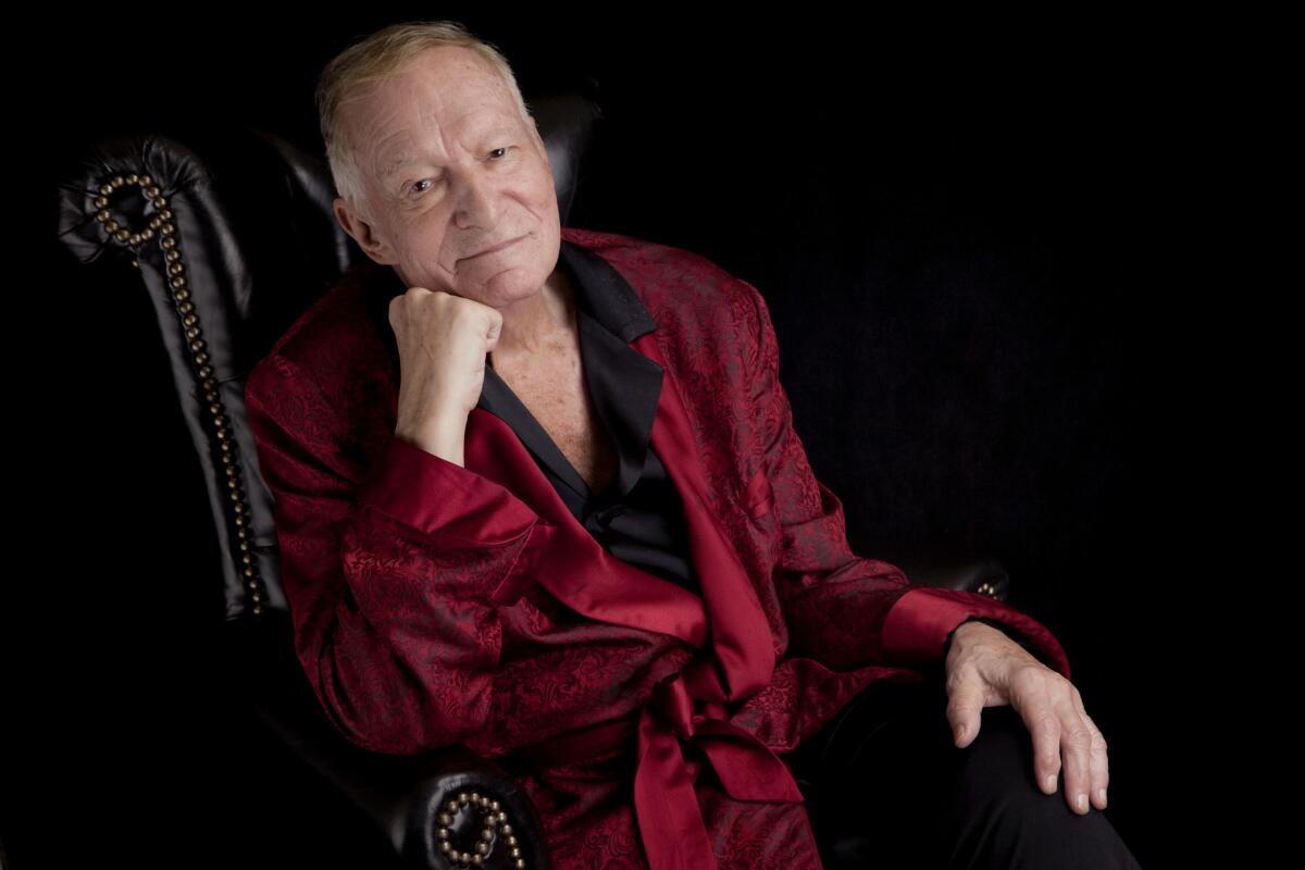 Hugh Hefner sits for a portrait in Los Angeles in August 2013. (Liz O. Baylen / Los Angeles Times)