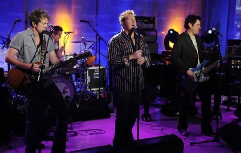 Rascal Flatts, from left, Joe Don Rooney , Gary LeVox, and Jay DeMarcus, of the country music group Rascal Flatts, perform on the NBC "Today" television program in New York Tuesday, April 7, 2009. (AP Photo/Richard Drew)