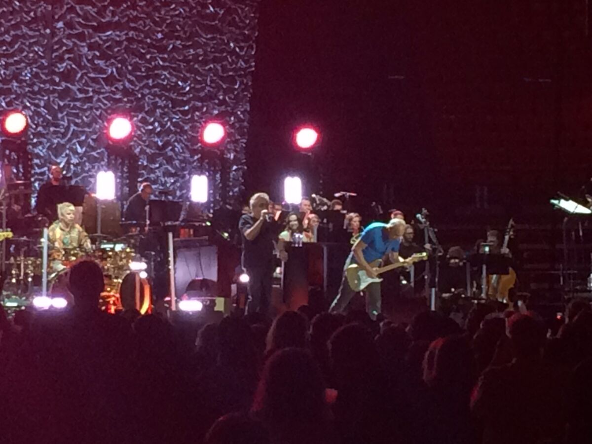 The Who are shown in action at the band's Wednesday night Viejas Arena concert, at which the group was accompanied by a 51-piece orchestra.