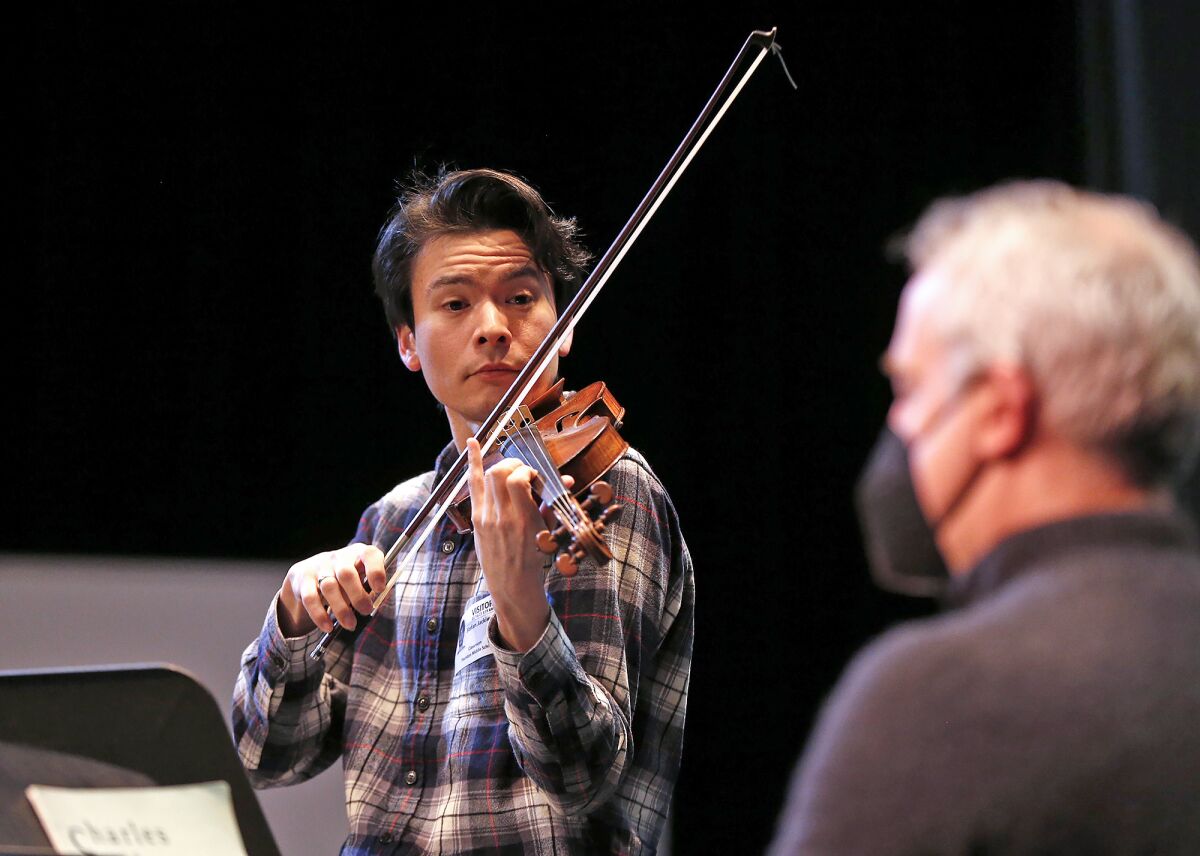 Violinist Stefan Jackiw joins pianist Jeremy Denk at Thurston Middle School on Thursday.