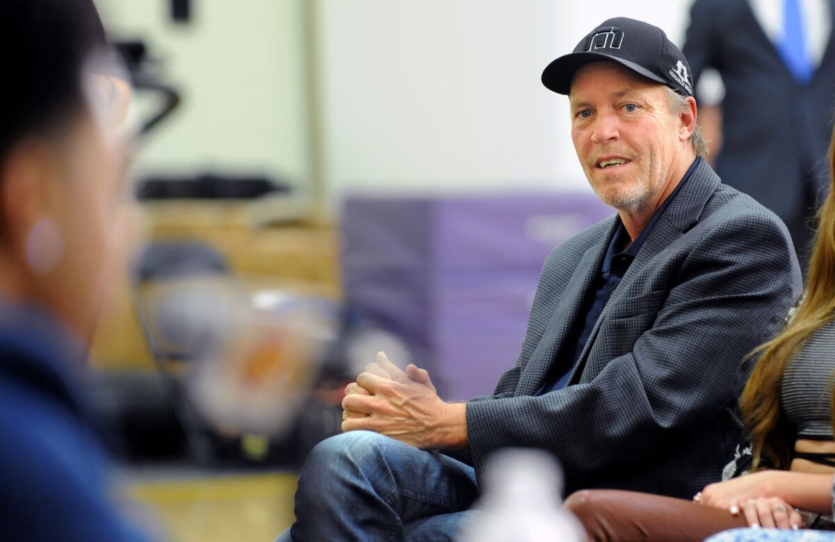 Jim Buss attends a June 29 news conference for D'Angelo Russell in El Segundo.