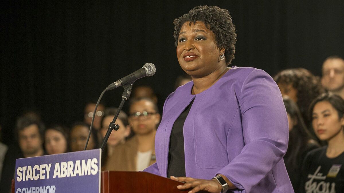 "Let's be clear: This is not a speech of concession," Democrat Stacey Abrams said Friday. "Because concession means to acknowledge an action is right, true or proper."