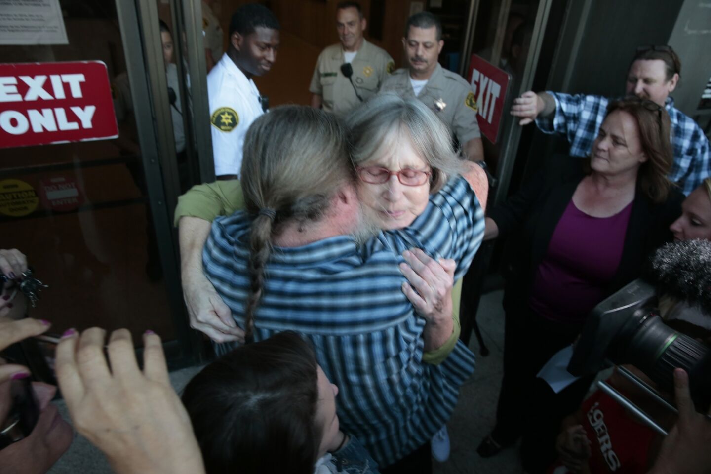 Susan Mellen hugs her brother Michael after she was released from prison.