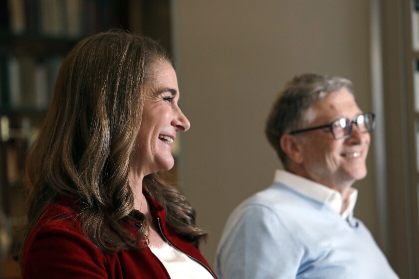 In this photo taken Feb. 1, 2019, Bill and Melinda Gates are interviewed in Kirkland, Wash. Bill Gates and Melinda French Gates will continue their work with the Giving Pledge, but, following their divorce earlier this year, they will do it separately and in their own ways. In individual letters posted Tuesday, Nov. 30, 2021 by Giving Pledge, the campaign they co-founded with Warren Buffett in 2010 to encourage billionaires to donate the majority of their wealth through philanthropy, Gates and French Gates outlined their differing philosophies to giving. (AP Photo/Elaine Thompson)