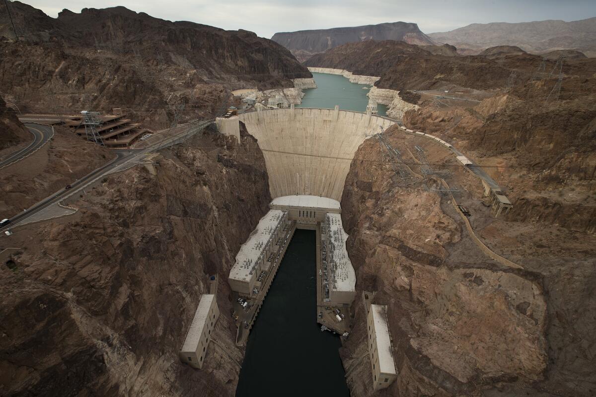 Lake Mead, behind the Hoover Dam, surrounded by the "bathtub ring" illustrating the lower water level caused by drought.