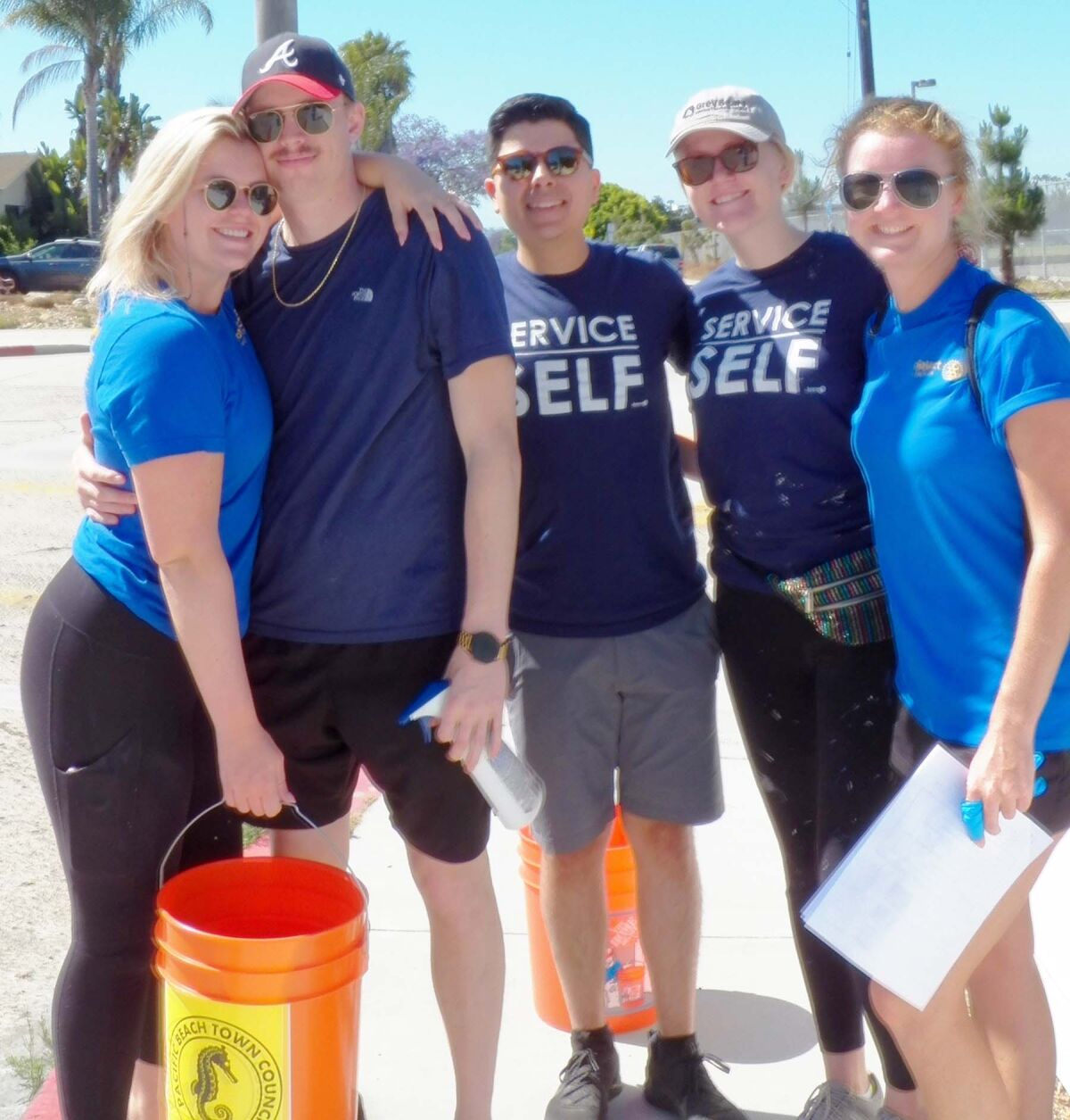 Rotaract members were among teams that fanned out across Pacific Beach to remove graffiti.
