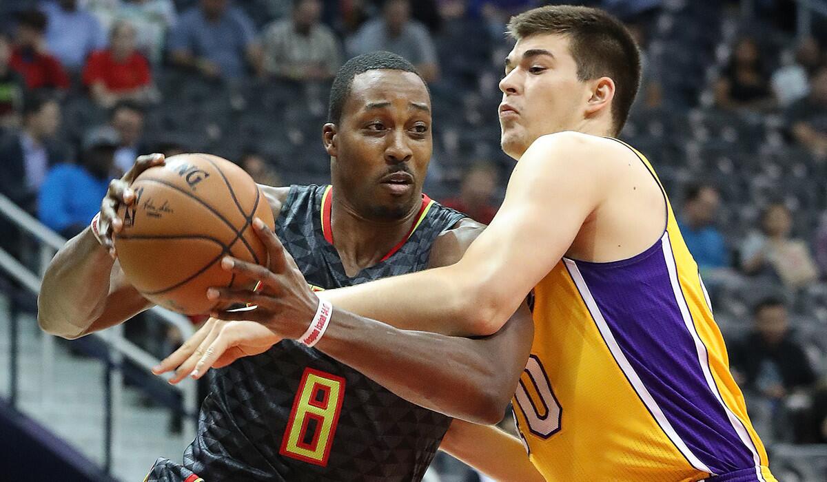 The Atlanta Hawks' Dwight Howard (8) drives against Lakers' Ivica Zubac during the first period on Nov. 2.