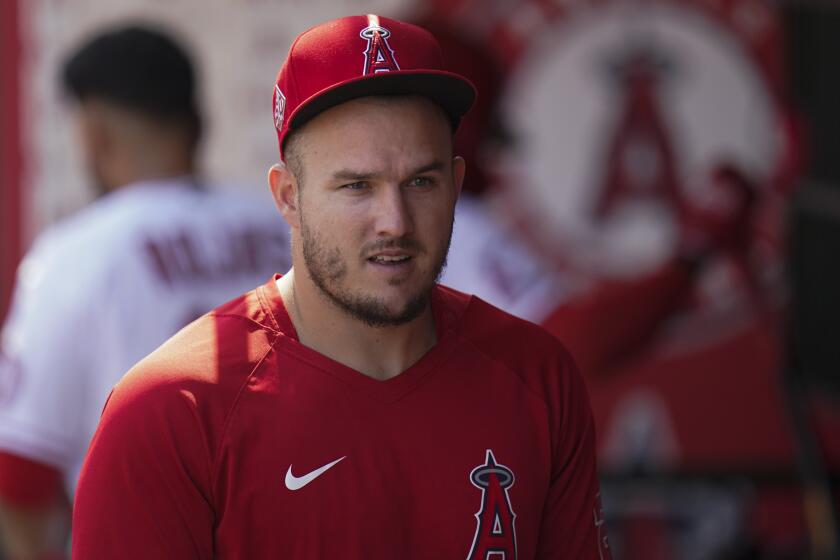 Los Angeles Angels' Mike Trout walks through the detour during a baseball game.