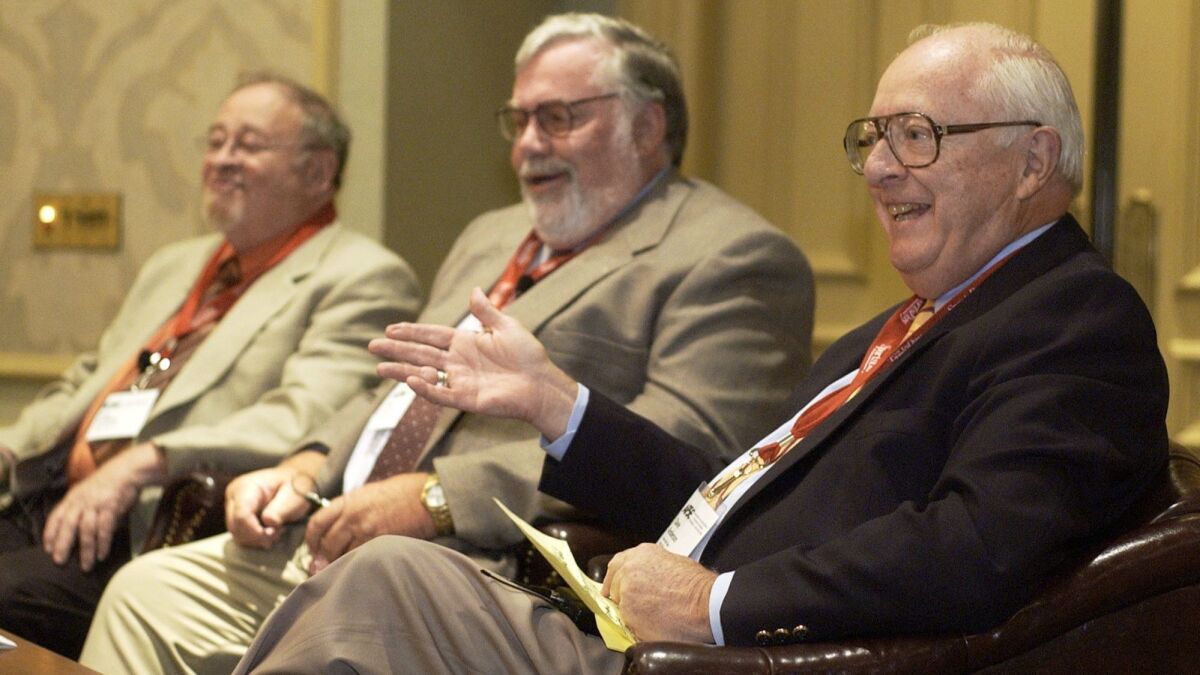Dave Anderson, right, gestures while on a 2004 panel discussion with Jerry Izenberg, left, Newark Star-Ledger sports columnist, and Bill Conlin, Philadelphia Daily News sports columnist.