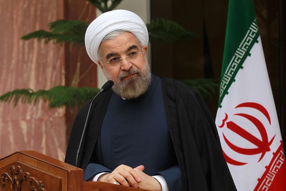 Iran President Hassan Rouhani speaks during a press conference in Tehran a day after a deal was reached on the country's nuclear program.