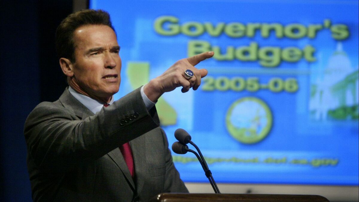 Gov. Arnold Schwarzenegger presents his proposed state budget for 200506 at a news conference in Sacramento in 2005.