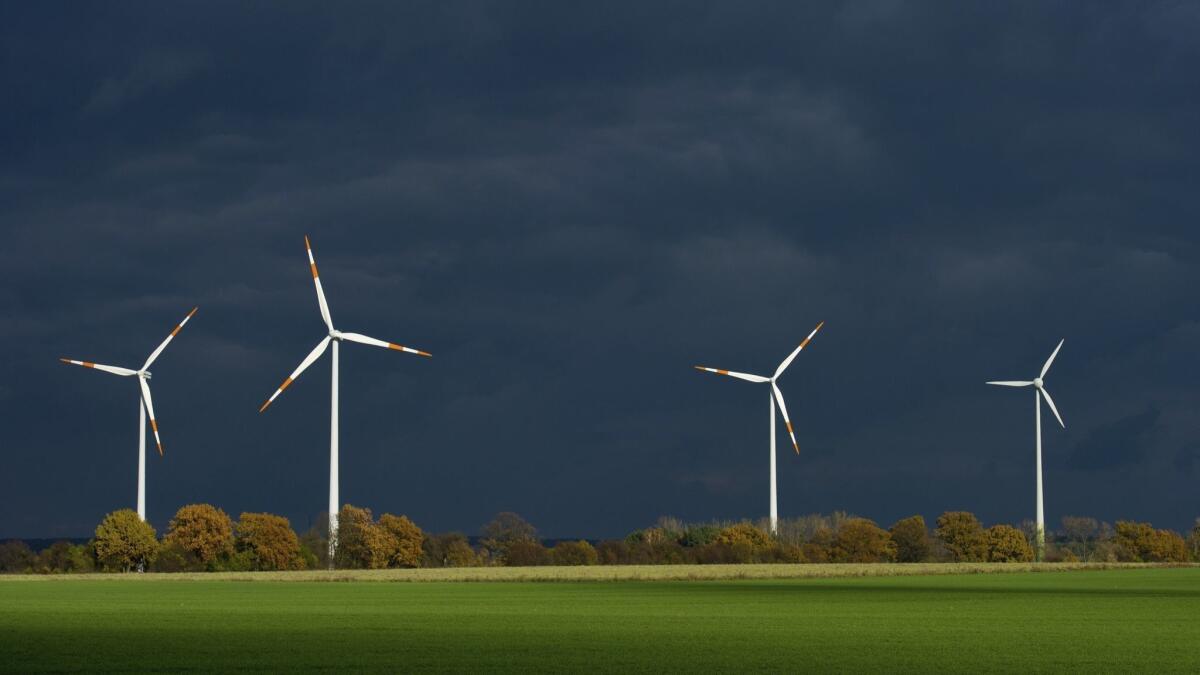 Wind turbines in Furstenwalde, Germany. Wind power accounts for 160,000 jobs in Germany, but the country's integration of renewable energy sources has been less than smooth.