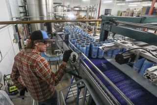 Gordon Gerski works to can Wipeout IPA at The Lost Abbey/Port Brewing on March 25, 2020 in San Marcos, California. This beer was supposed to go to restaurants and bars, but closure of those establishments because of CoronaVirus COVID-19 means the beer will end up at markets and liquor stores.