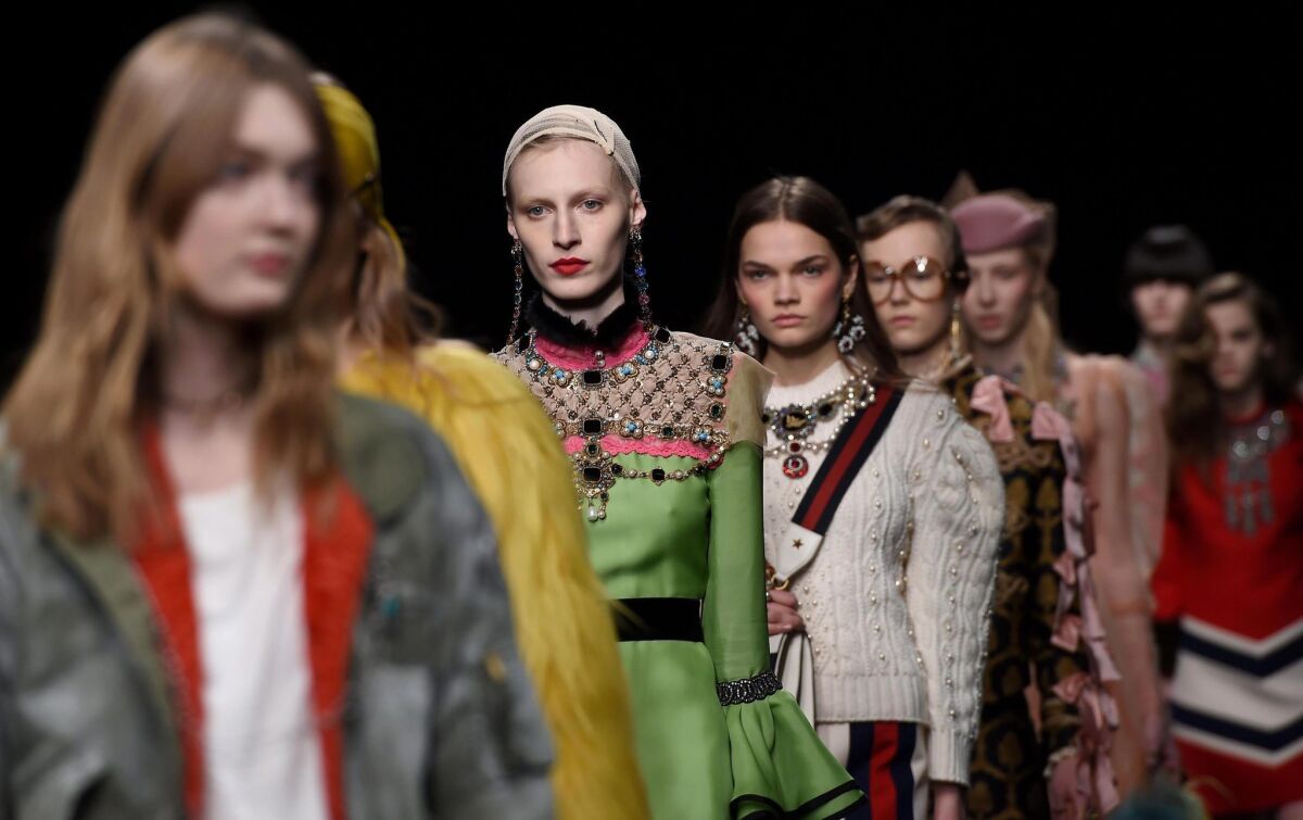 The Gucci women's collection on the Milan Fashion Week runway.