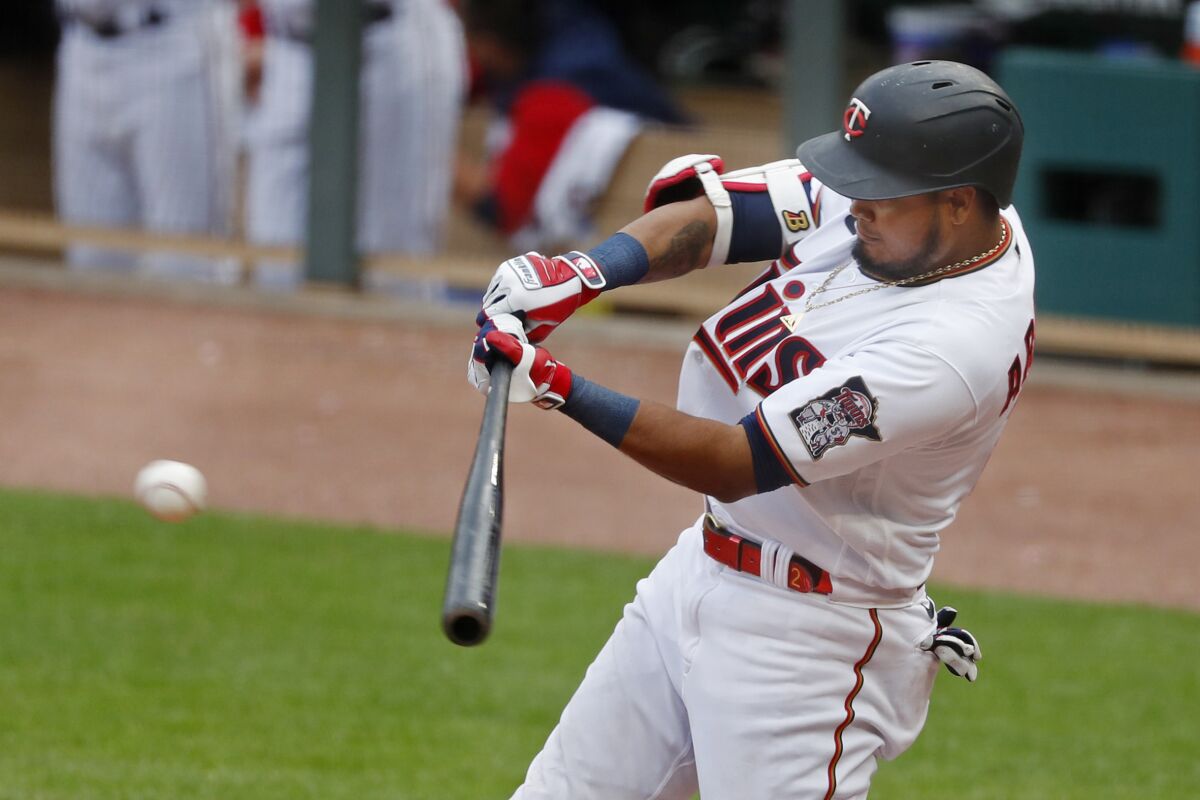 Minnesota Twins' Luis Arraez hits an RBI single against the Chicago White Sox during the seventh inning of a baseball game Saturday, April 23, 2022, in Minneapolis. The Twins won 9-2. (AP Photo/Bruce Kluckhohn)
