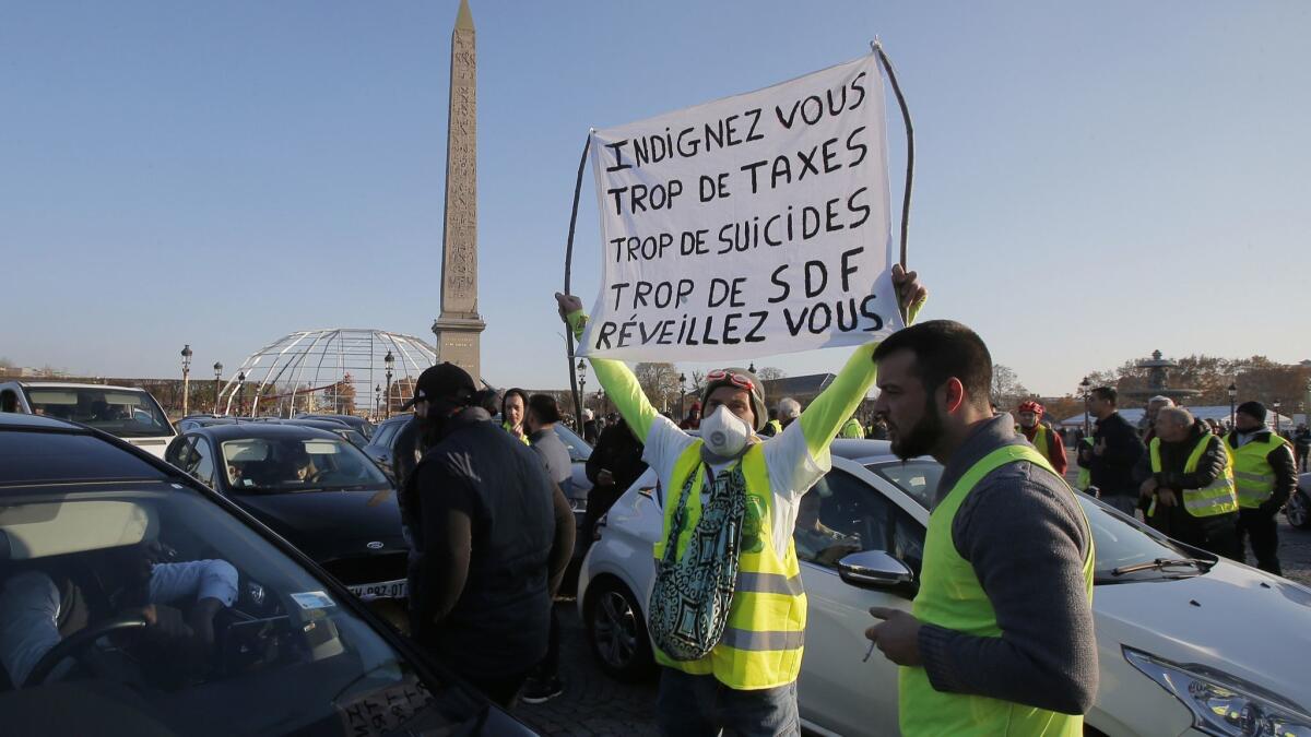 Protesters block traffic on Paris' Place de la Concorde on Nov. 17 to protest fuel taxes.