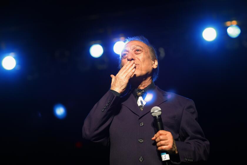 GLENDALE, AZ-- FEBRUARY 13, 2009-- Art Laboe, a disc jockey for more than 50 years, blows a kiss to the audience, during his 2009 Art Laboe Valentine's Super Love Jam concert at the Jobing.com arena in Glendale, Feb. 13, 2009. Laboe, 84, has a loyal fan base, which consists heavily of Latinos, who request melodramatic love songs not often heard on the radio. (Jay L. Clendenin/Los Angeles Times)