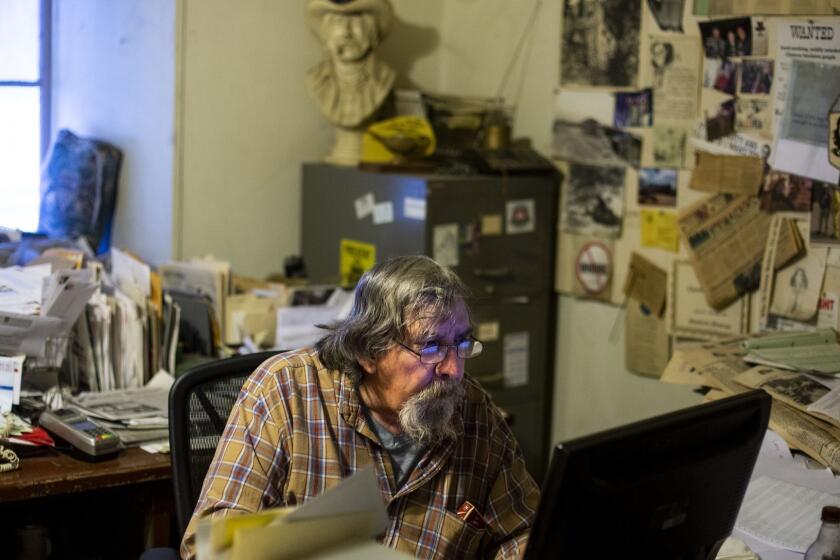 DOWNIEVILLE, CALIF. - DECEMBER 13: Don Russell works in the Mountain Messenger newsroom on Thursday, Dec. 13, 2018 in Downieville, Calif.. (Kent Nishimura / Los Angeles Times)
