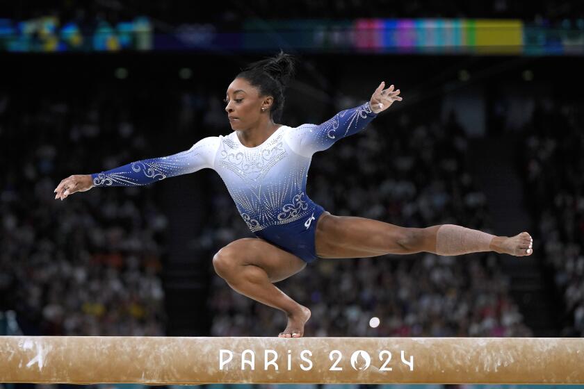 Simone Biles, of the United States, competes during the women's artistic gymnastics.