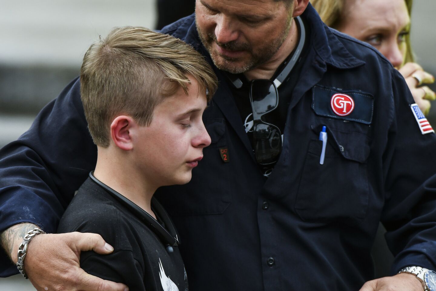 Students are reunited with their parents after being evacuated to the Recreation Center at Northridge after a shooting at STEM School Highlands Ranch on May 7, 2019, in Highlands Ranch, Colo.
