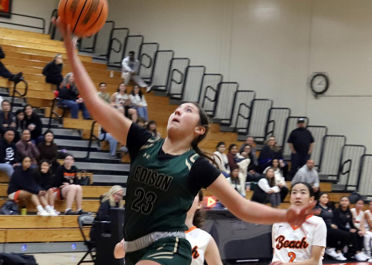 Edison's Mia Cassel (23) drives for a layup against Huntington Beach on Saturday.