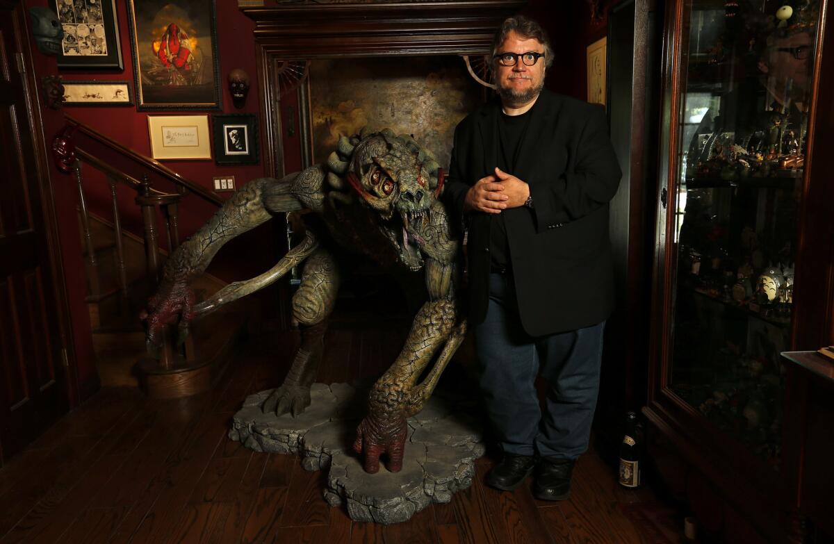 Writer and director Guillermo del Toro stands with a sculpture from "Hellboy" at his Bleak House last year.