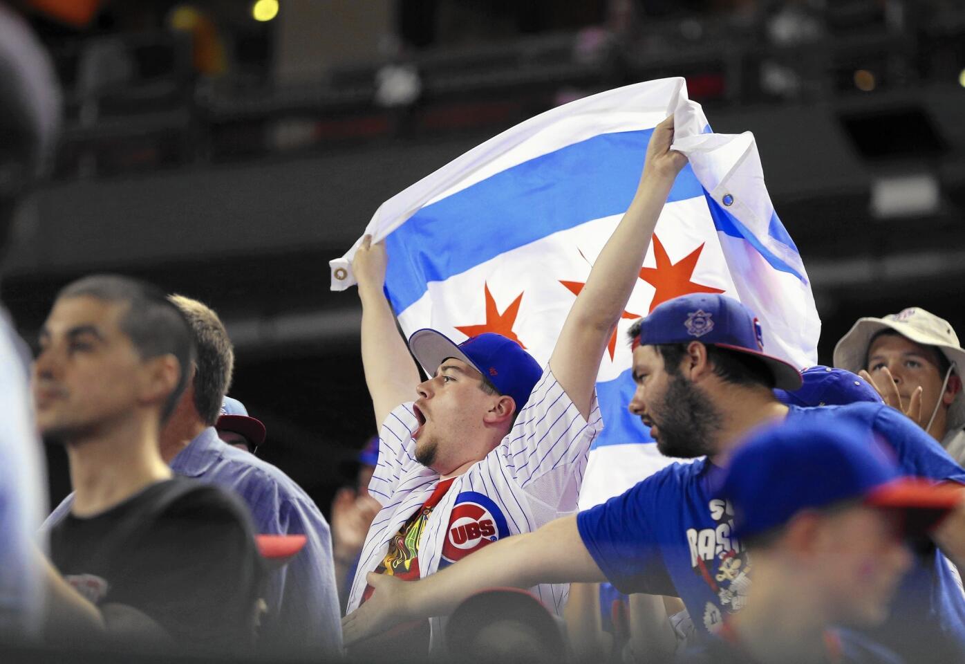 Chicago Cubs fans show their pride in St. Louis during an early-season game against the Cardinals.