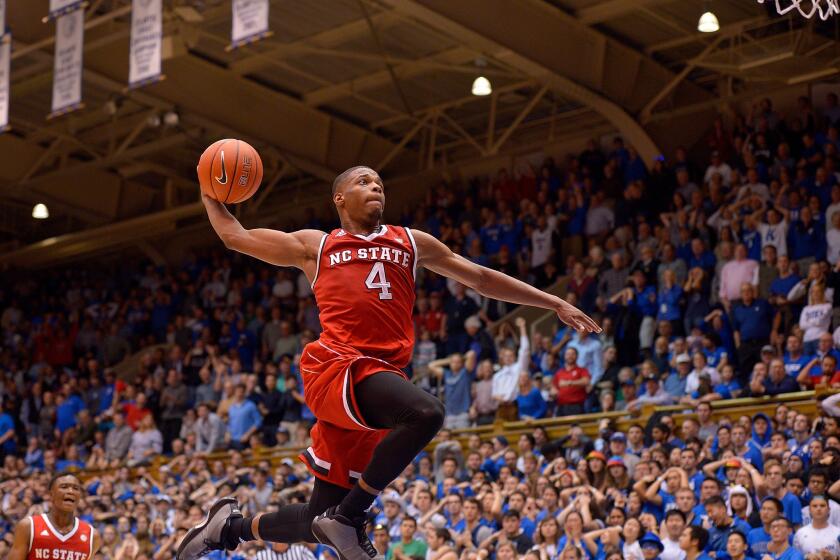 North Carolina State guard Dennis Smith Jr. (4) drives in for a dunk as time expires during a win against Duke at Cameron Indoor Stadium on Jan. 23.