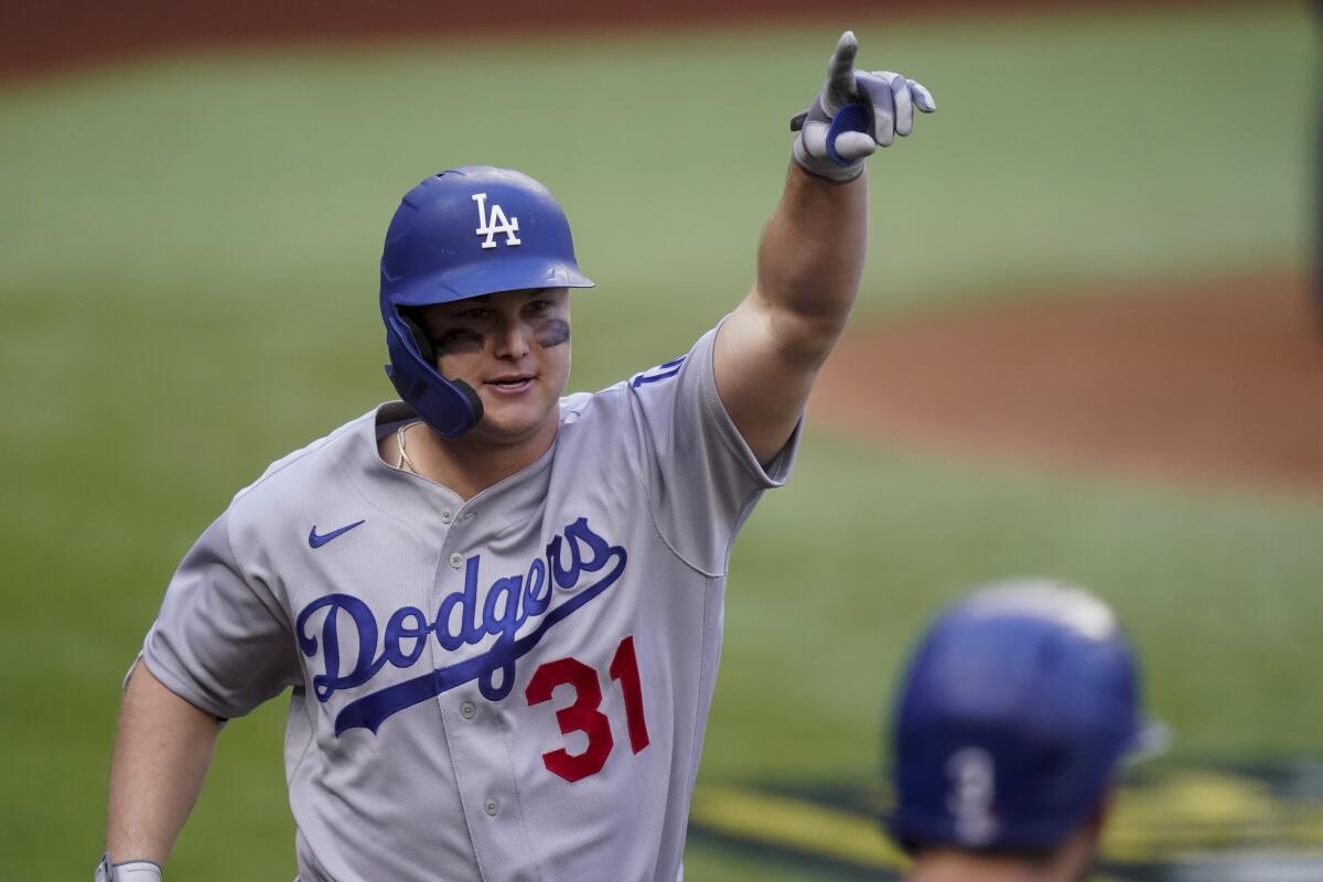 Joc Pederson points to the stands