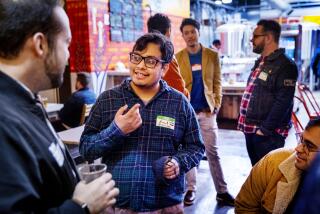 Pasadena, CA - November 15: Angel Lozano, center, a former student at East Los Angeles College, meets with a screenwriters at Cerveceria Del Pueblo in Pasadena Tuesday, Nov. 15, 2022. (Allen J. Schaben / Los Angeles Times) Lozano, who dropped out of college, is hoping to pursue his dream of becoming an actor. He's writing a movie script, but he's also worked as a cart wrangler at Target and now supervises activities at an assisted living facility.